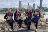 Queensland Symphony Orchestra performs state’s AFL anthems